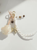 Bijou de Sac Coquillage Nacré & Étoile Dorée - Perles Bohème Chic - Bijoux Bymadéa