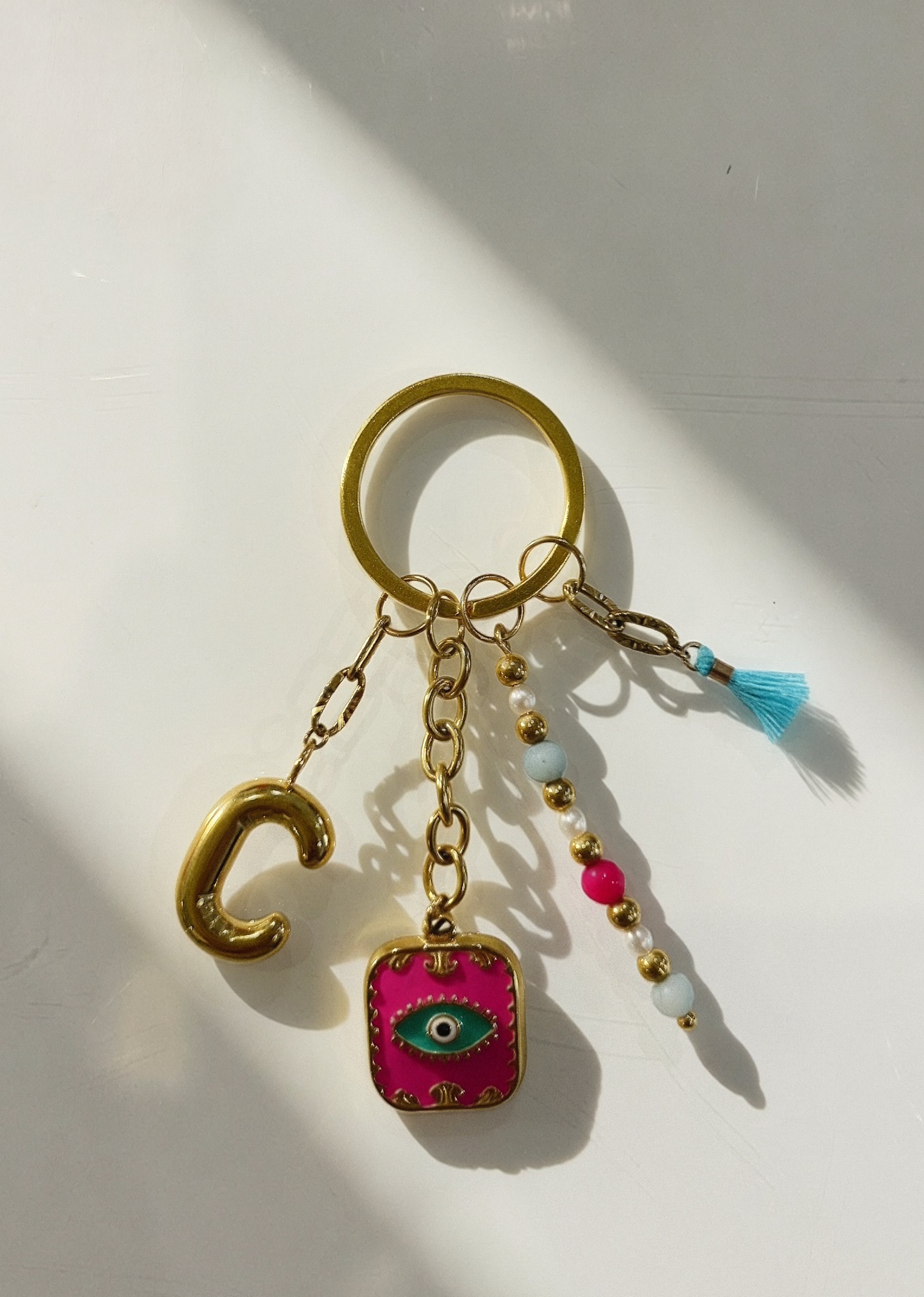 Porte-Clés Bag Charm Initiale C - Oeil Protecteur Fuchsia & Pompon Turquoise
